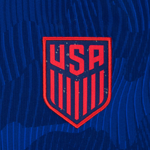 Youth Nike USMNT 2023 Personalized Away Stadium Jersey in Blue - Badge View